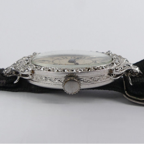 106 - A platinum, Art Deco diamond set cocktail watch, gross weight 12.6 grams, 36.6 mm x 17.3 mm.