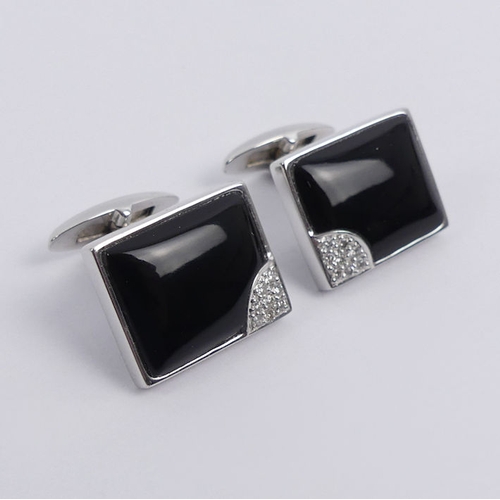 20E - A pair of 14ct white gold, black onyx and diamond cufflinks, 7.9 grams, 15.2mm x 12.1mm.