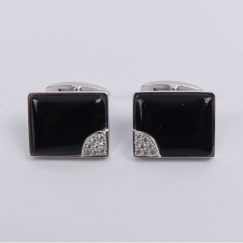 20E - A pair of 14ct white gold, black onyx and diamond cufflinks, 7.9 grams, 15.2mm x 12.1mm.