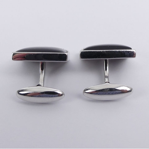 20E - A pair of 14ct white gold, black onyx and diamond cufflinks, 7.9 grams, 15.2mm x 12.1mm.