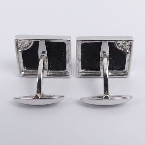 20E - A pair of 14ct white gold, black onyx and diamond cufflinks, 7.9 grams, 15.2mm x 12.1mm.