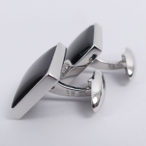 20E - A pair of 14ct white gold, black onyx and diamond cufflinks, 7.9 grams, 15.2mm x 12.1mm.