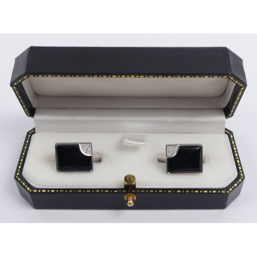 20E - A pair of 14ct white gold, black onyx and diamond cufflinks, 7.9 grams, 15.2mm x 12.1mm.