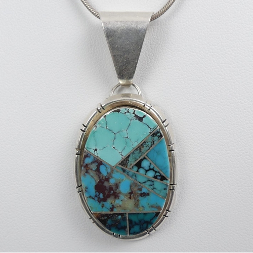 21 - Native American sterling silver, turquoise pendant and chain, 18.7 grams, pendant 52mm, chain 40cm.