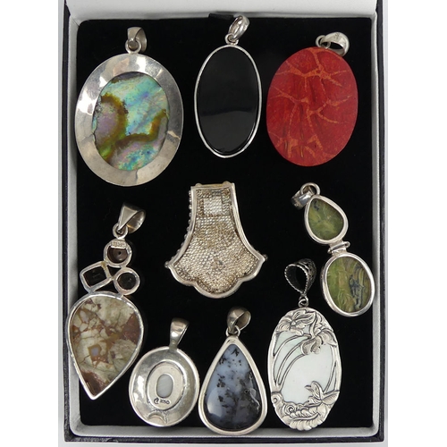 24 - Nine sterling silver and stone set pendants, 101 grams, longest 69mm.