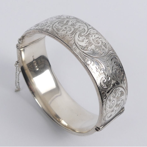 29 - Georg Jensen engraved scrolling feather design hinged silver bangle, London 1959, 63.8 grams, 22mm w... 