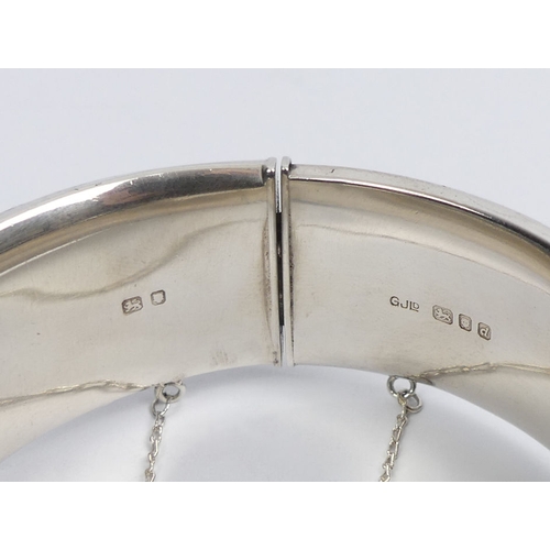 29 - Georg Jensen engraved scrolling feather design hinged silver bangle, London 1959, 63.8 grams, 22mm w... 