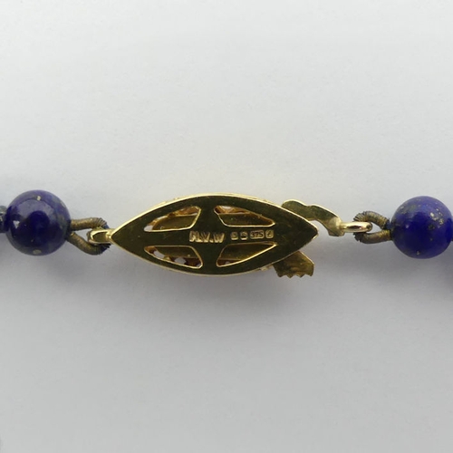 30A - A lapis lazuli bead necklace with a 9ct gold clasp, 11 grams, 42 cm x 4.2 mm.