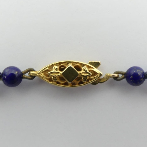 30A - A lapis lazuli bead necklace with a 9ct gold clasp, 11 grams, 42 cm x 4.2 mm.