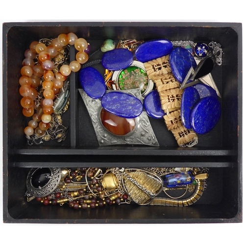 30B - An Arts & Crafts jewellery box and contents, including a lapis lazuli necklace.