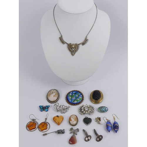 31 - A box of mixed costume jewellery, including a Limoges enamel brooch and various cameo brooches.