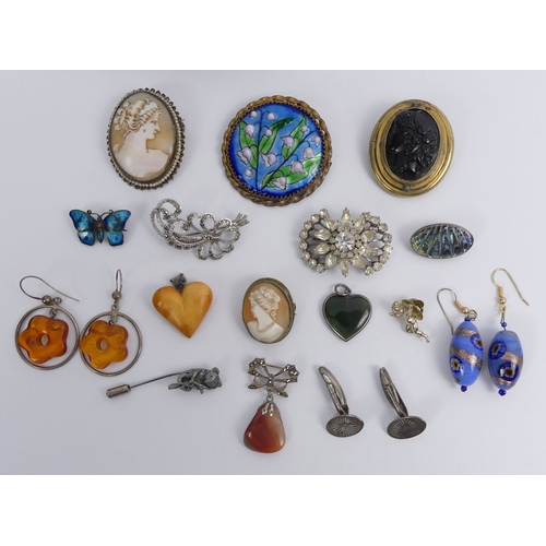 31 - A box of mixed costume jewellery, including a Limoges enamel brooch and various cameo brooches.