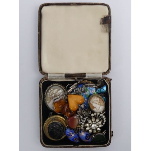 31 - A box of mixed costume jewellery, including a Limoges enamel brooch and various cameo brooches.