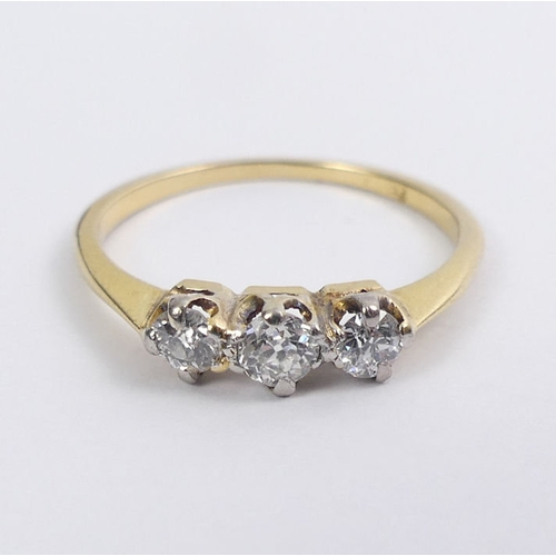 34 - 18ct gold three stone diamond ring, 1.9 grams, 4.1mm, size N.