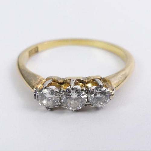 35 - 18ct gold, three stone diamond ring, approximately .25ct total, 2.8 grams, 4.7mm, size O 1/2.