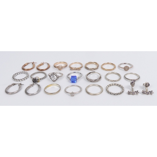 39 - Various silver Pandora and other rings, along with silver earrings, 47 grams.