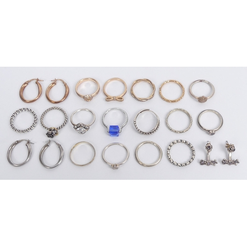 39 - Various silver Pandora and other rings, along with silver earrings, 47 grams.