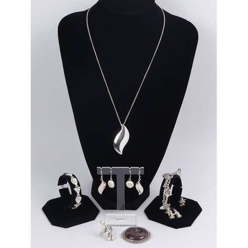 44 - Various items of silver jewellery, including a matching pendant and earrings set and a charm bracele... 