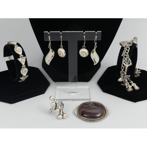 44 - Various items of silver jewellery, including a matching pendant and earrings set and a charm bracele... 