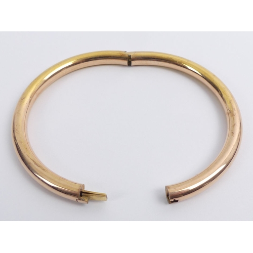 60G - 10ct rose gold, concealed clasp, oversize bangle, 16.9 grams, 7.1mm, internal circumference 22cm.