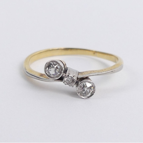 60J - 18ct gold and platinum (tested), three stone, diamond ring, 1.4 grams, size K 1/2.