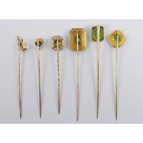 84 - Six Victorian 9ct gold peridot set stick pins, 11.6 grams, longest 67mm.