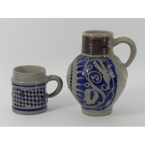 386 - An 18th century German Westerwald stoneware commemorative jug, together with a tankard both embossed... 