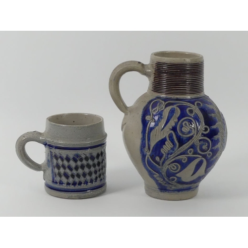 386 - An 18th century German Westerwald stoneware commemorative jug, together with a tankard both embossed... 