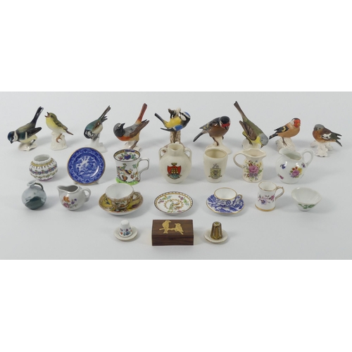 389 - Nine Goebel's birds together with miniature ceramics including Coalport and Masons, 9cm.