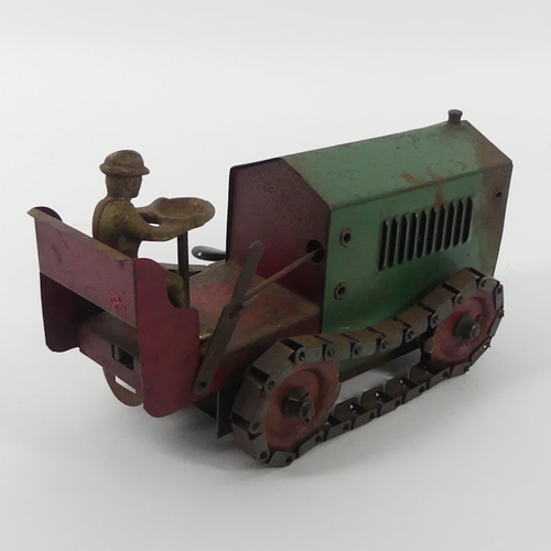 394 - A Structo tin plate clockwork caterpillar tractor, 22cm x 10cm.