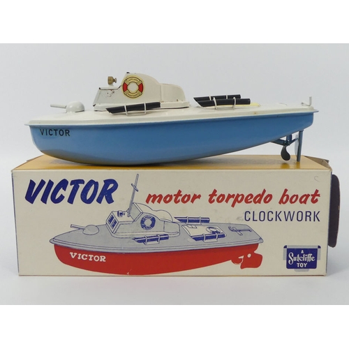 397 - A boxed Sutcliffe Victor torpedo tin plate clockwork boat, 24cm x cm.