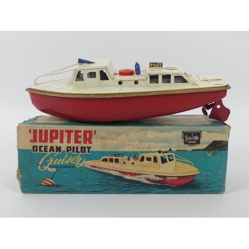 398 - A boxed Sutcliffe Jupiter ocean pilot tin plate clockwork boat, 24cm x 8cm.