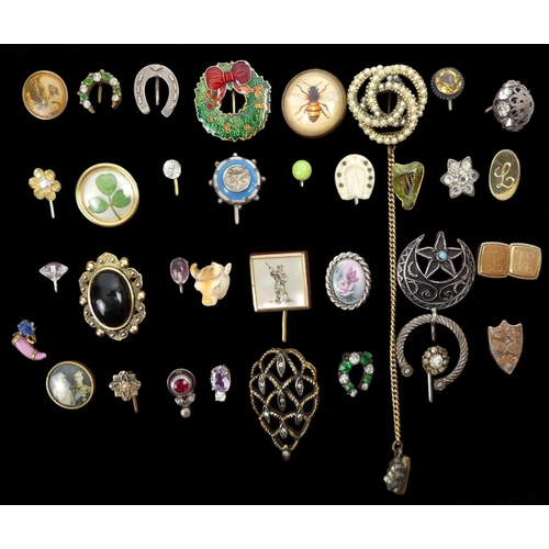 81 - A box of various stick pins, including silver and enamel and a gold a turquoise topped example.