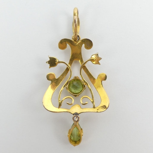 11 - 15ct gold, peridot and seed pearl Art Nouveau pendant, 3.1 grams, 48mm x 21mm.