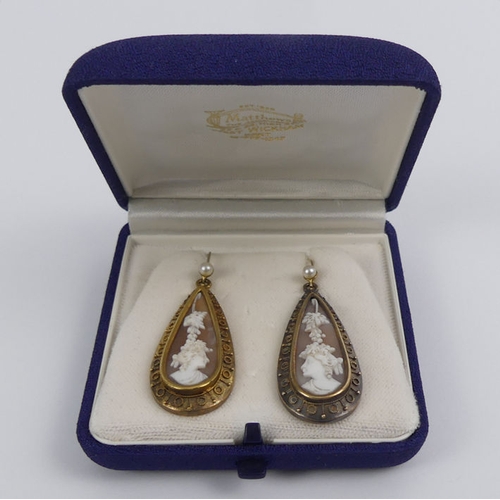 19 - A pair of Victorian gold mounted shell cameo earrings, 7.2 grams, 47mm x 16.6mm.