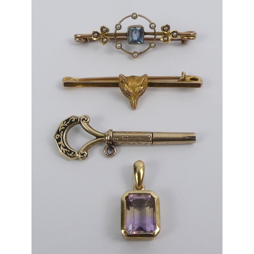 20 - A 9ct fox design bar brooch, a 9ct gold topaz and seed pearl brooch, a 9ct Victorian watch key and a... 