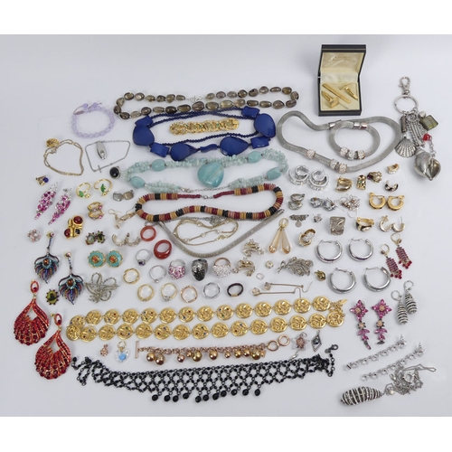 25 - A tin of mixed costume jewellery, including stone set brooches and Lola Rose.