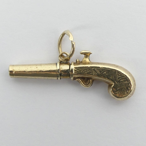 33 - A Victorian gold (un-marked) watch key in the form of a pistol, 2.6 grams, 27.5mm.