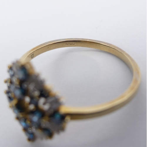 38 - 9ct gold, fancy blue and white diamond ring, 2.1 grams, size P 1/2.