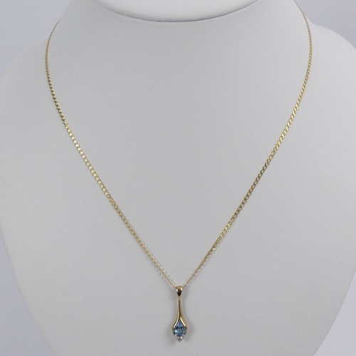 42 - 9ct gold, blue topaz and diamond pendant and chain, 2.1 grams.