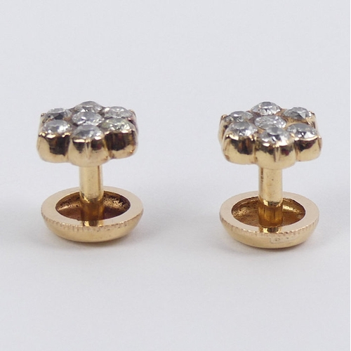 43 - A pair of 18ct gold (tested) diamond cluster screw studs, total diamond weight approximately .7ct, 4... 