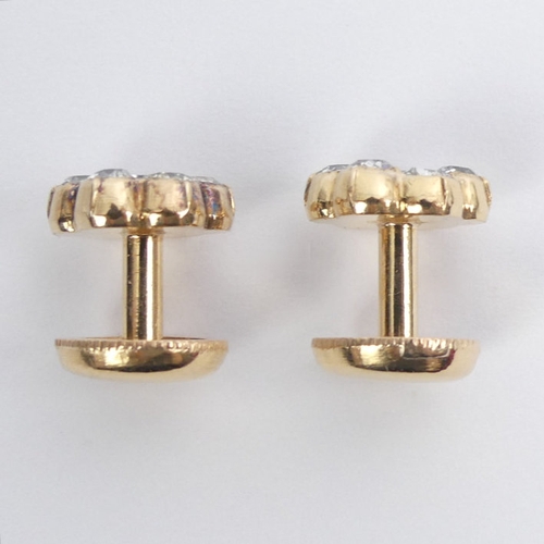 43 - A pair of 18ct gold (tested) diamond cluster screw studs, total diamond weight approximately .7ct, 4... 