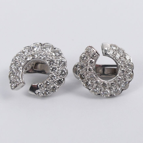 44 - A pair of 18ct white gold (tested) graduated diamond 'C' design earrings, 6 grams, 14.8mm.