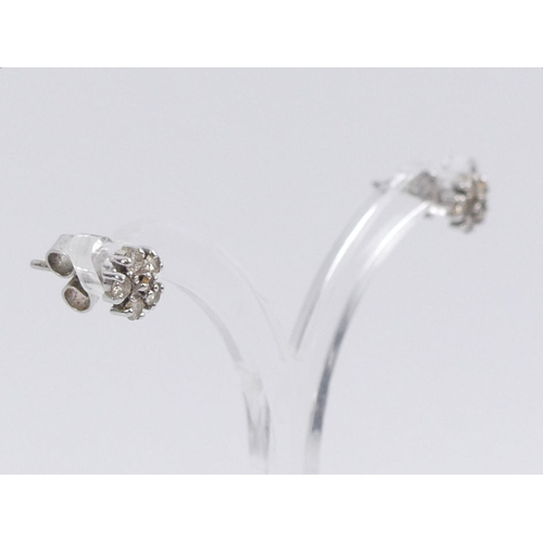 50A - A pair of 9ct white gold, diamond cluster earrings, 1.1 grams, 6.2mm.