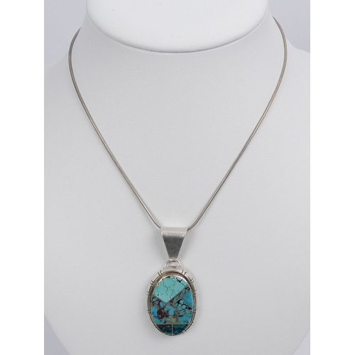 21 - Native American sterling silver, turquoise pendant and chain, 18.7 grams, pendant 52mm, chain 40cm.