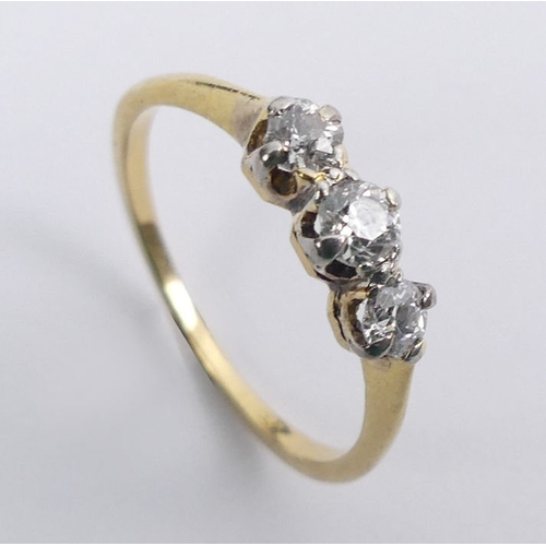 34 - 18ct gold three stone diamond ring, 1.9 grams, 4.1mm, size N.