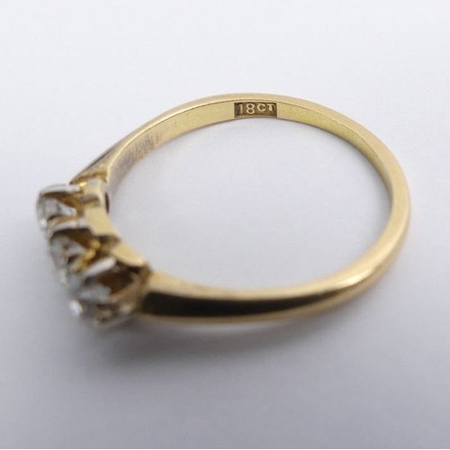 35 - 18ct gold, three stone diamond ring, approximately .25ct total, 2.8 grams, 4.7mm, size O 1/2.