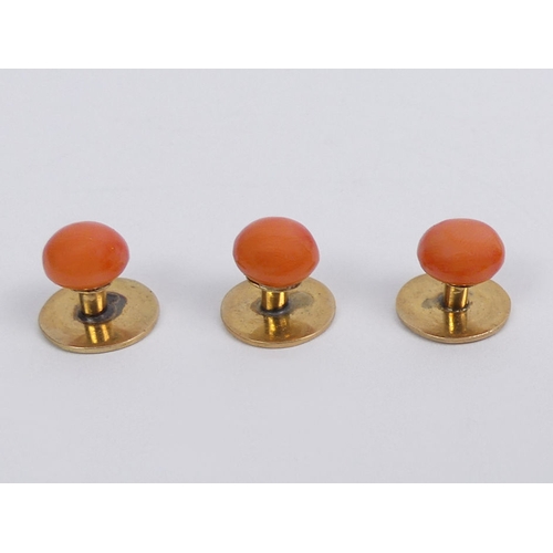 36 - Three Victorian yellow metal and coral studs in the original box, 4.7 grams, 10.8m diameter.