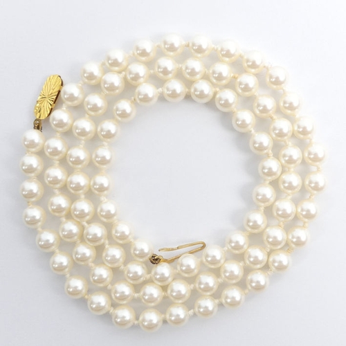 60A - A Lotus pearl necklace with a 9ct gold clasp and original presentation box, 23.5 grams, 60 cm x 5.9 ... 