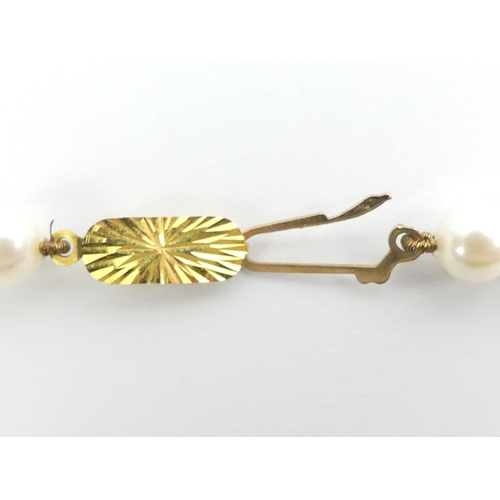 60A - A Lotus pearl necklace with a 9ct gold clasp and original presentation box, 23.5 grams, 60 cm x 5.9 ... 